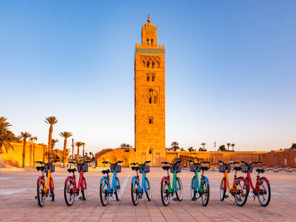 Travelers enjoying a bike tour in Marrakech Medina with colorful souks