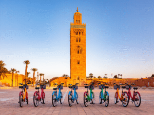 Travelers enjoying a bike tour in Marrakech Medina with colorful souks